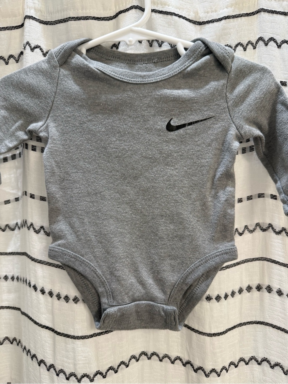 Nike Gray Long-Sleeve Baby Bodysuit with Black Swoosh